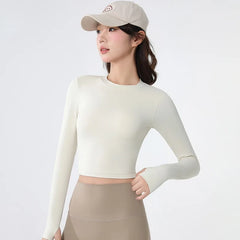 Backless long-sleeve crop top for yoga/fitness.