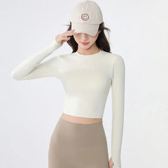 Backless long-sleeve crop top for yoga/fitness.