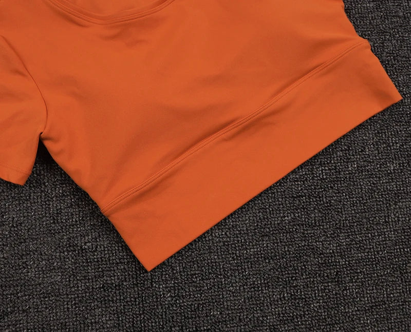 Women’s Gym Crop Top – breathable, elastic, removable pads.