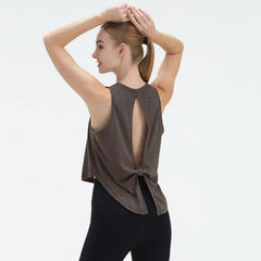  Sleeveless Yoga and Fitness Tank Top in [Blue]. Shows a comfortable, breathable fit perfect for studio stretching and running.