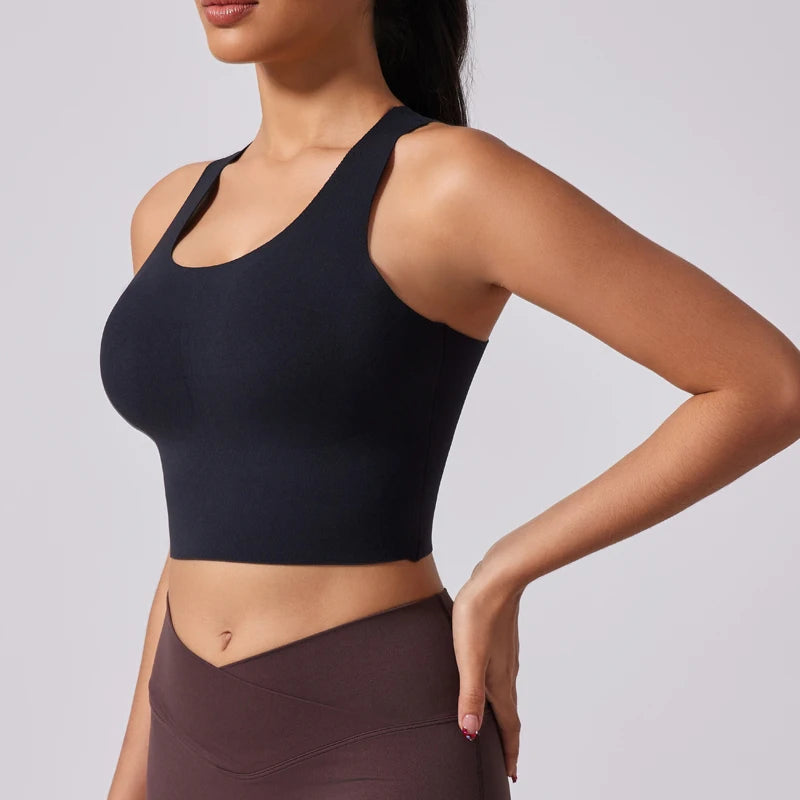 Woman wearing black B-Fit yoga bra with wide straps