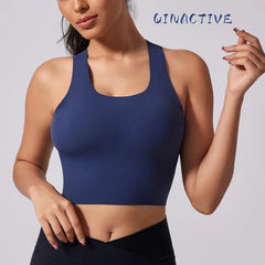 Woman wearing blue B-Fit yoga bra with wide straps