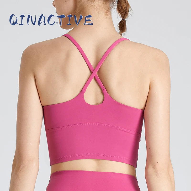 Woman wearing B-Fit one-shoulder sports bra for yoga and fitness

