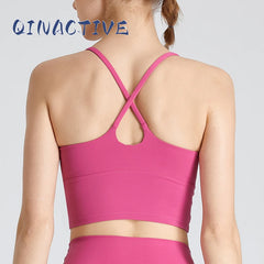 Woman wearing B-Fit one-shoulder sports bra for yoga and fitness

