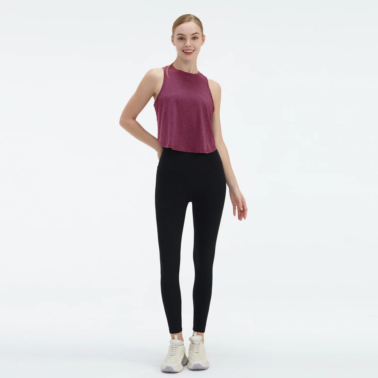  Sleeveless BeFit Yoga and Fitness Tank Top in [ Burgundy]. Shows a comfortable, breathable fit perfect for studio stretching and running.