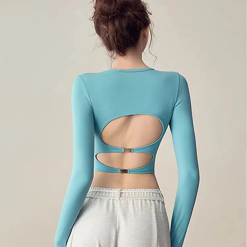 Backless long sleeve yoga top with pads, quick-dry and tight fit for gym and fitness.