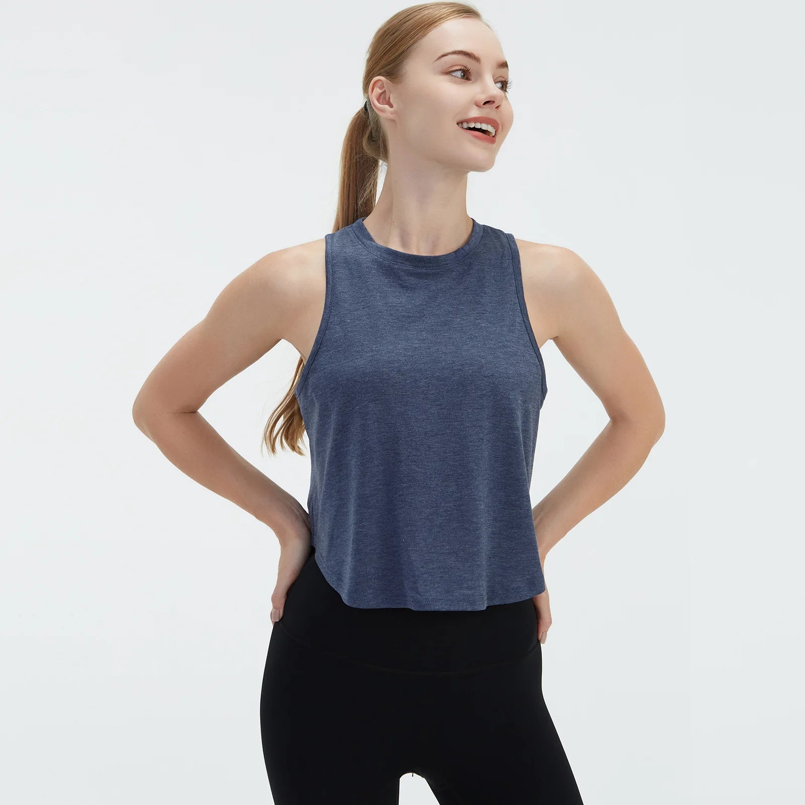 Sleeveless BeFit Yoga and Fitness Tank Top in [Blue]. Shows a comfortable, breathable fit perfect for studio stretching and running.