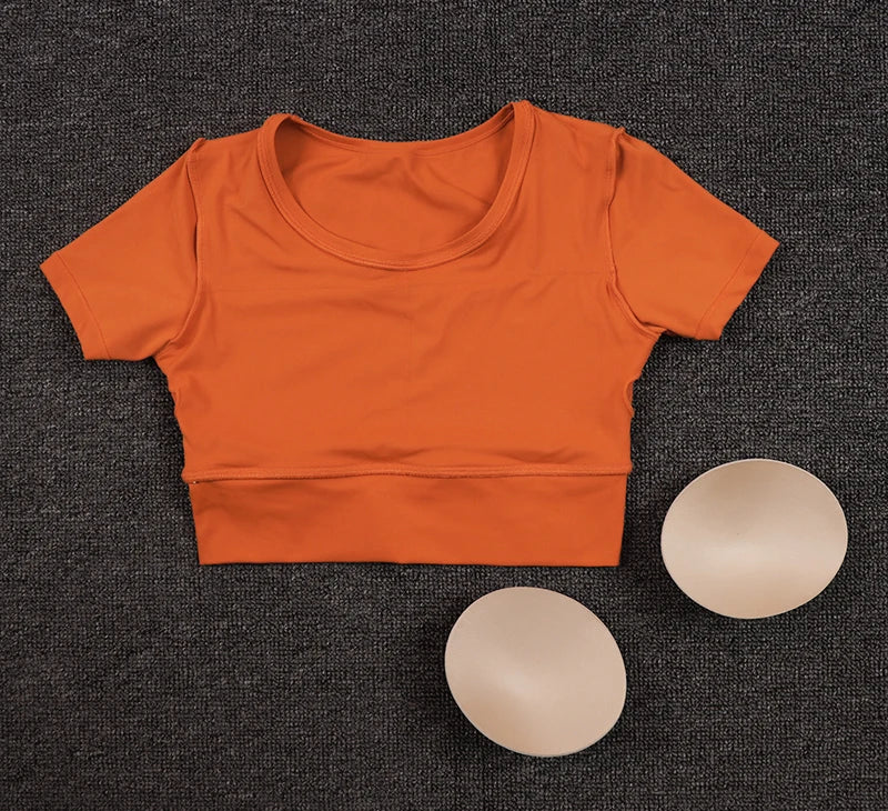 Women’s Gym Crop Top – breathable, elastic, removable pads.