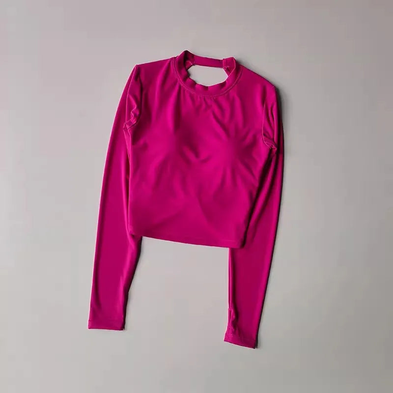 Backless long-sleeve crop top for yoga/fitness.