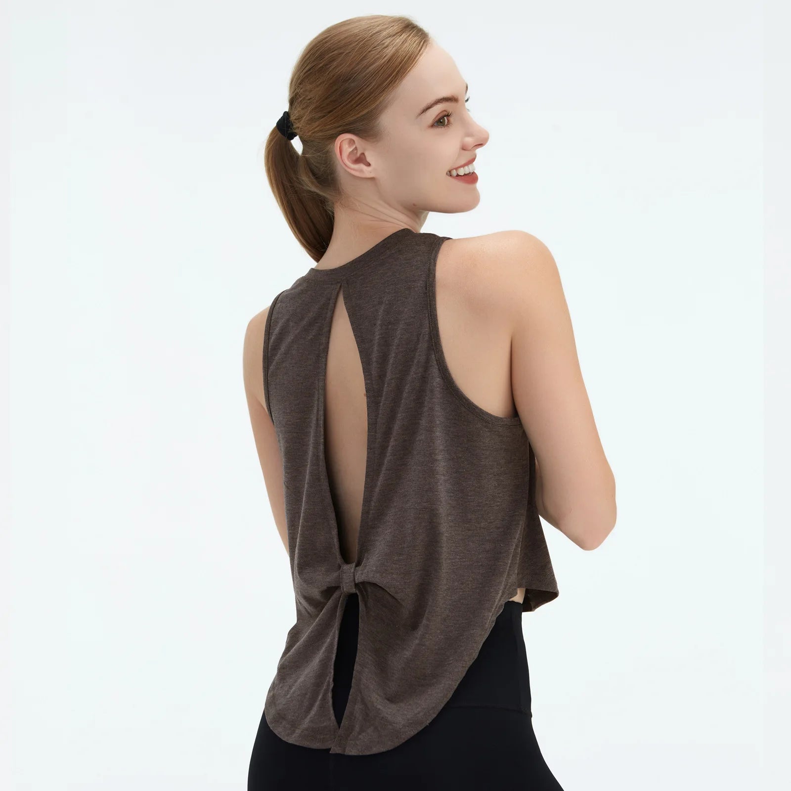  Sleeveless BeFit Yoga and Fitness Tank Top in [ dark grey]. Shows a comfortable, breathable fit perfect for studio stretching and running.