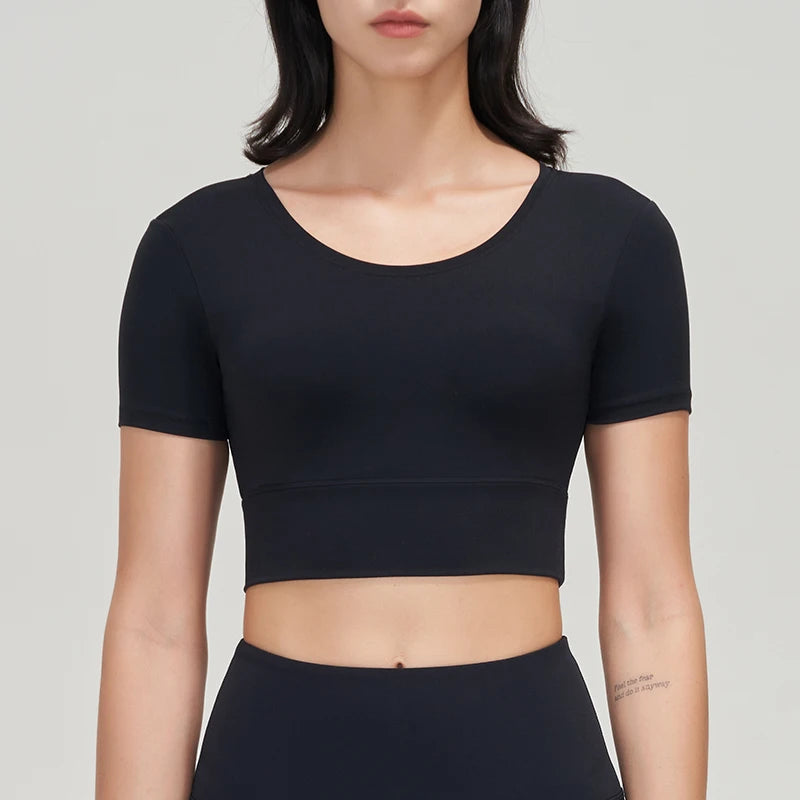 Women’s Gym Crop Top – breathable, elastic, removable pads.