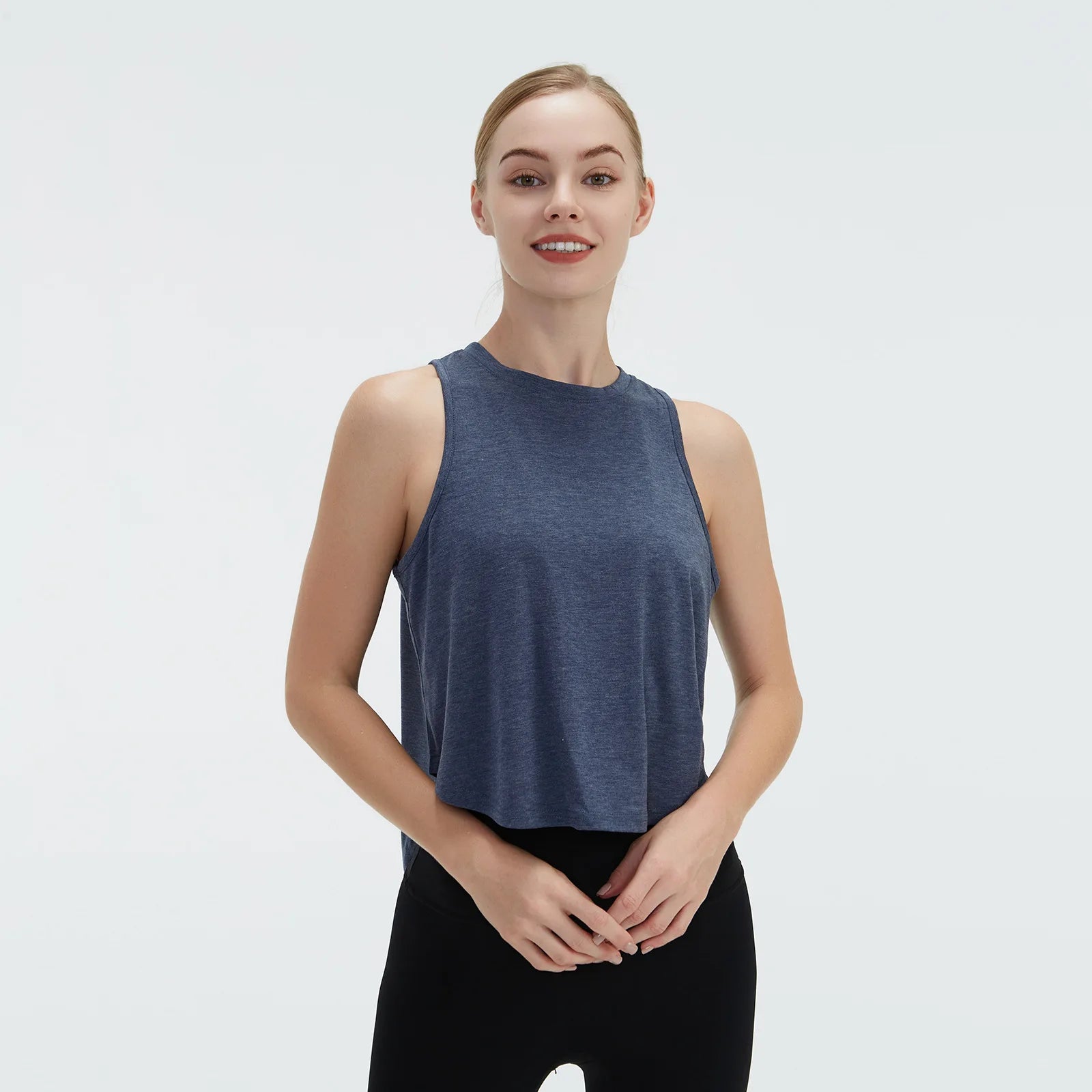  Sleeveless BeFit Yoga and Fitness Tank Top in [Blue]. Shows a comfortable, breathable fit perfect for studio stretching and running.