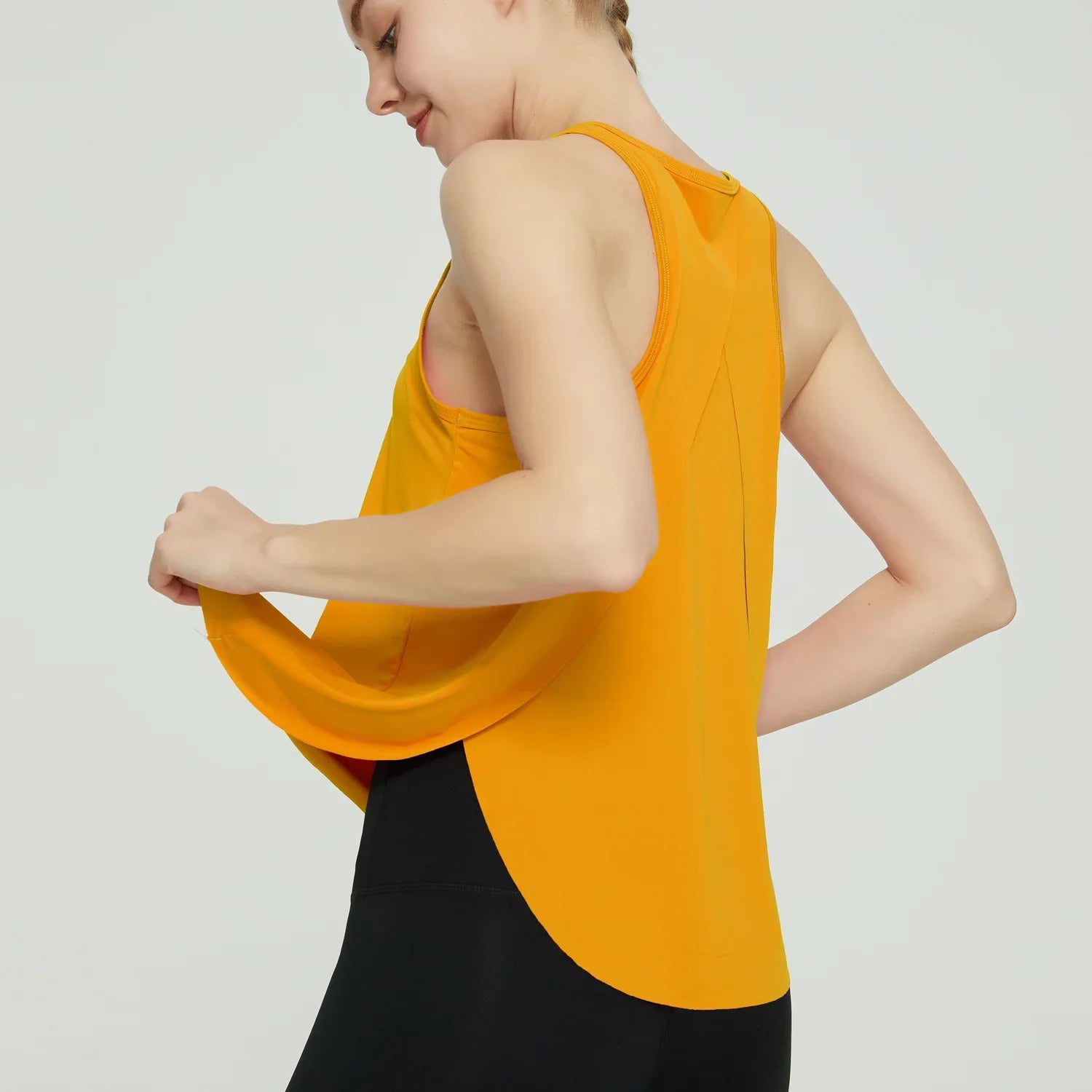 Racerback Tank Top: Quick-dry, breathable shirt for yoga and workouts.