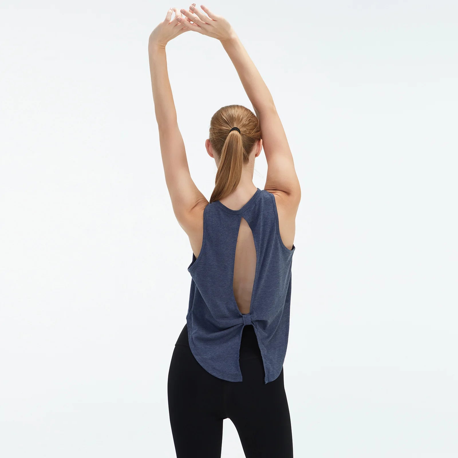  Sleeveless BeFit Yoga and Fitness Tank Top in [Blue]. Shows a comfortable, breathable fit perfect for studio stretching and running.