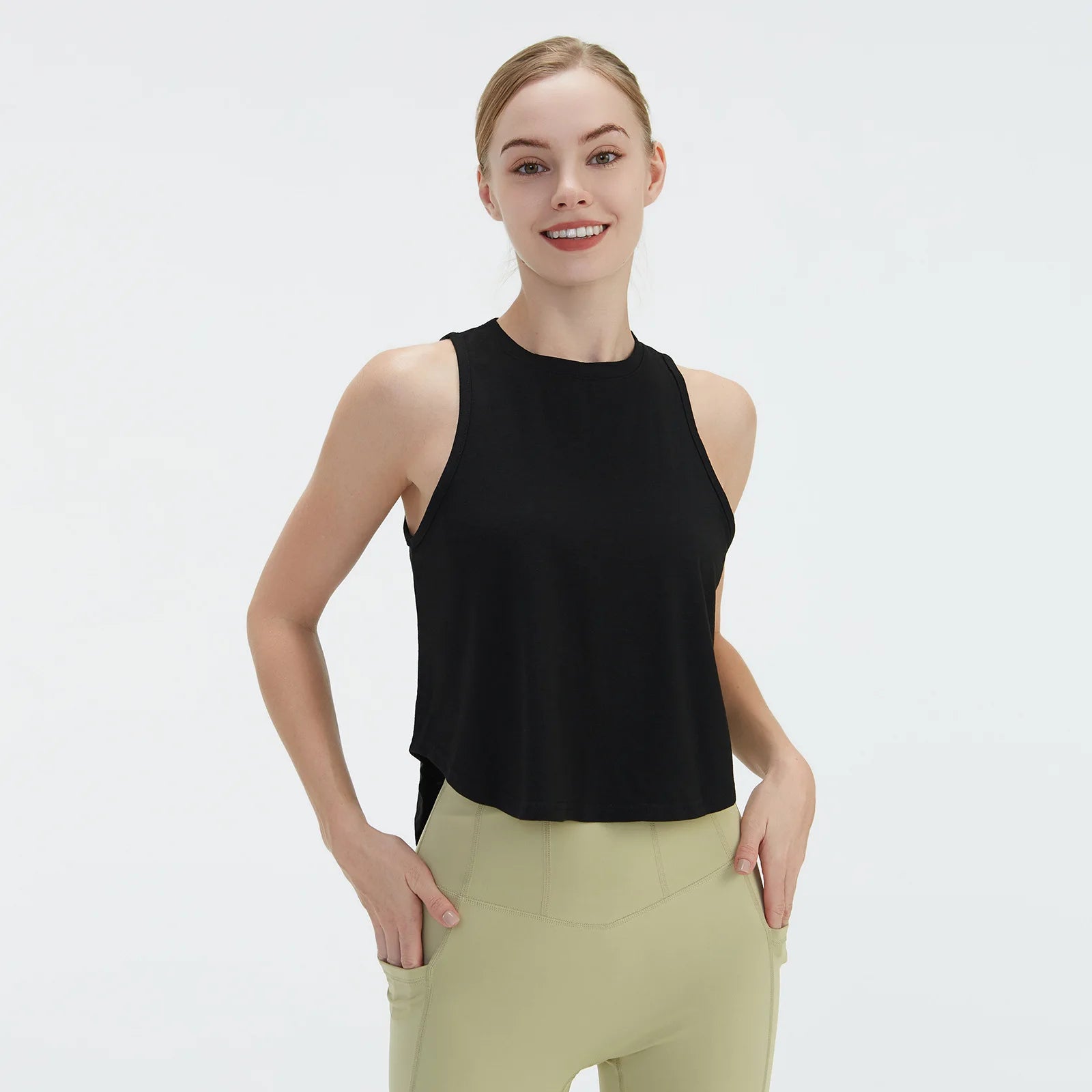  Sleeveless BeFit Yoga and Fitness Tank Top in [Black]. Shows a comfortable, breathable fit perfect for studio stretching and running.