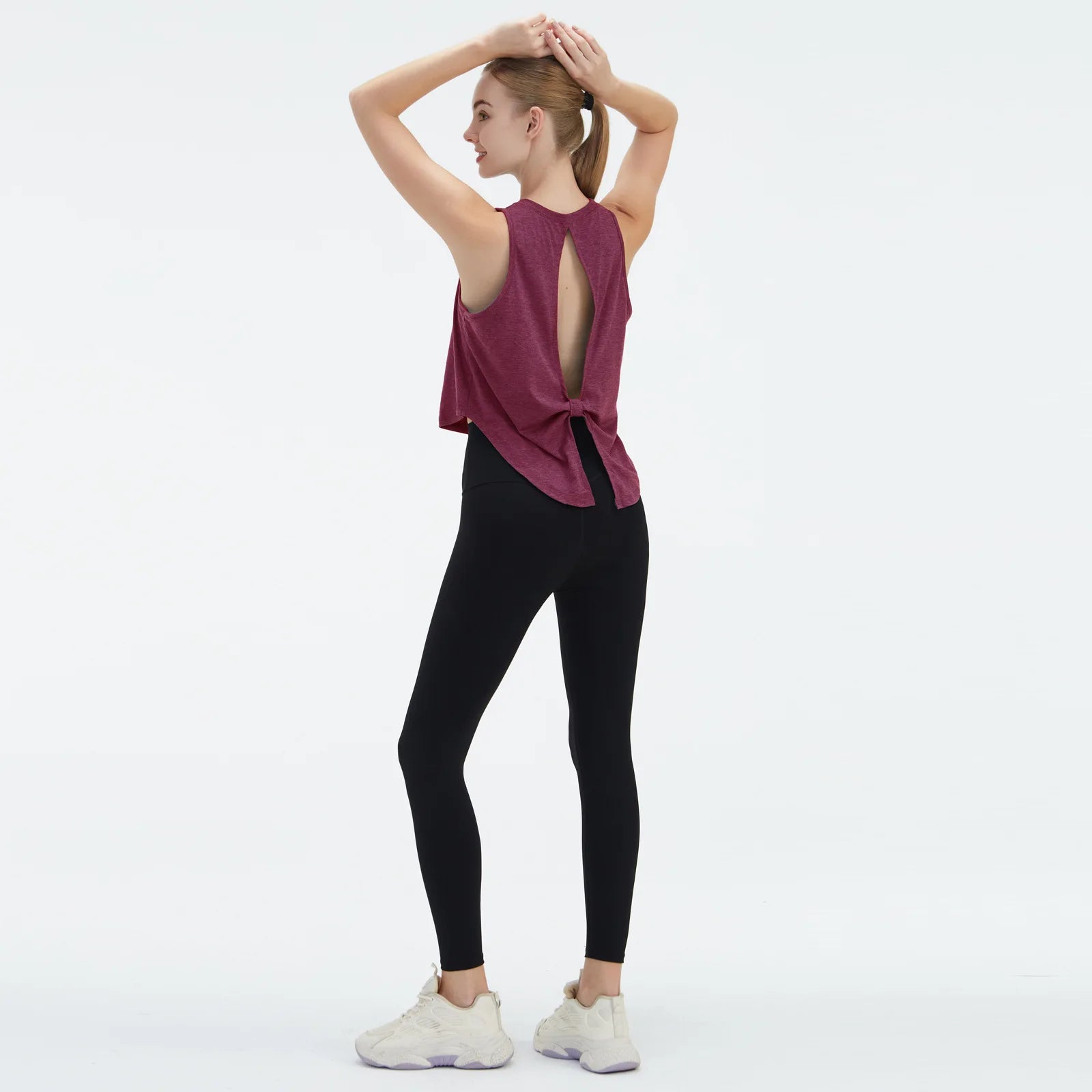  Sleeveless BeFit Yoga and Fitness Tank Top in [ Burgundy]. Shows a comfortable, breathable fit perfect for studio stretching and running.