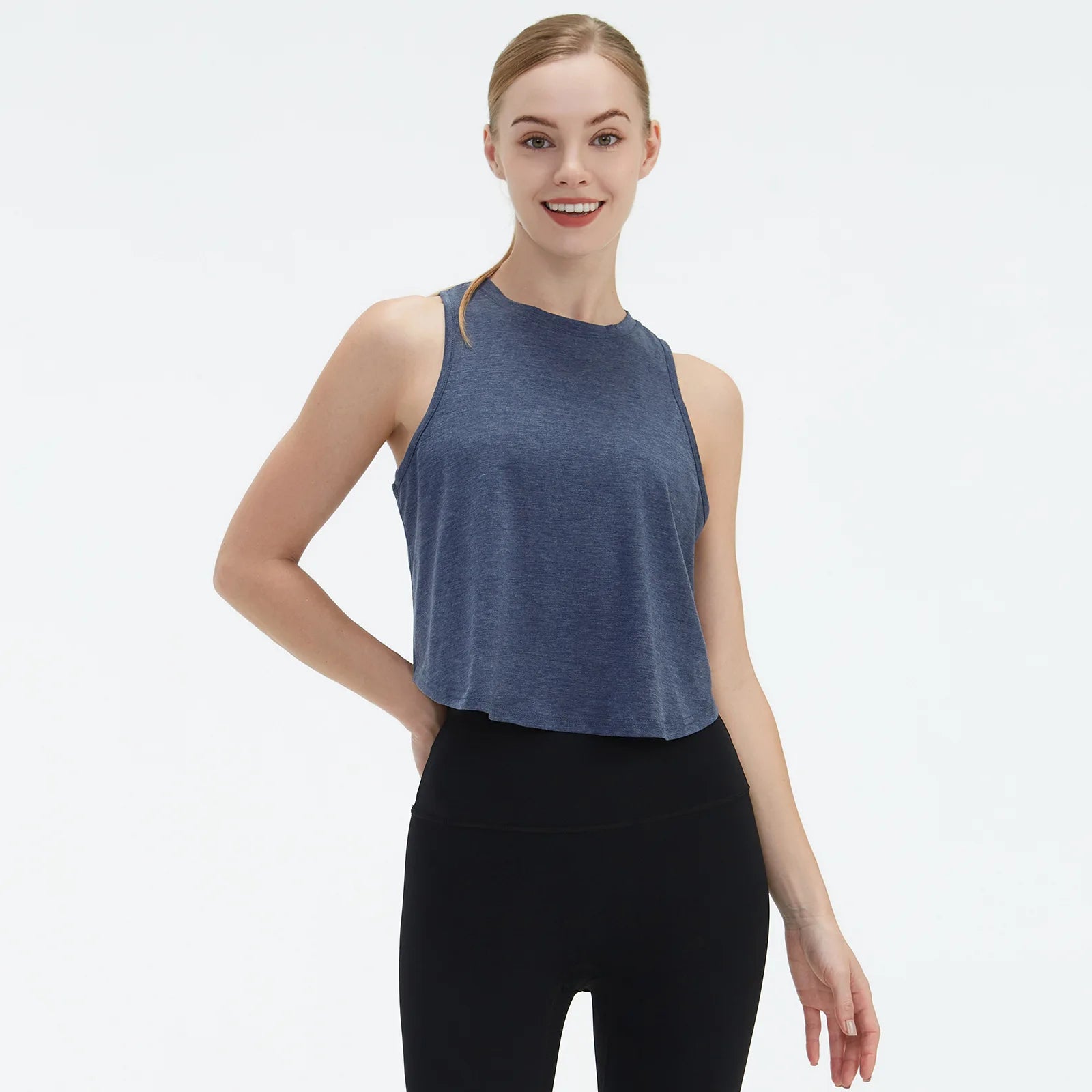  Sleeveless BeFit Yoga and Fitness Tank Top in [Blue]. Shows a comfortable, breathable fit perfect for studio stretching and running.