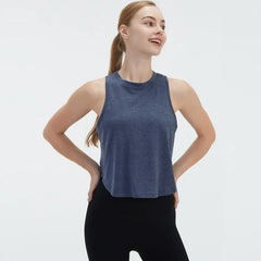  Sleeveless BeFit Yoga and Fitness Tank Top in a [Blue]. Shows a comfortable, breathable fit perfect for studio stretching and running.